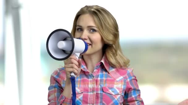 Young pretty woman speaking with megaphone. - Footage, Video