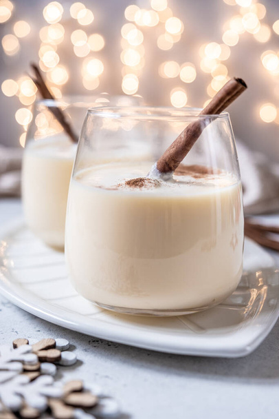 Traditional Christmas drink eggnog with cinnamon - Photo, Image
