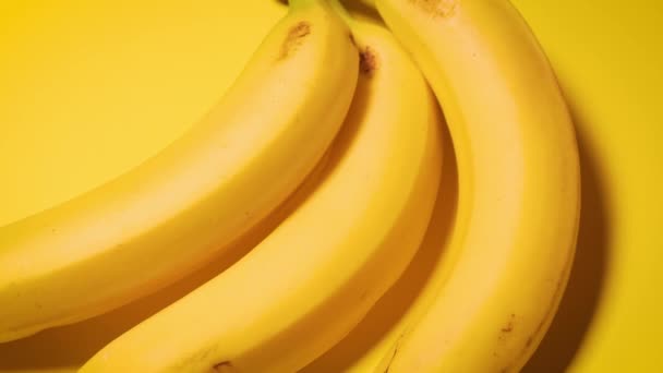 fresh bananas on a yellow minimalistic background - Footage, Video