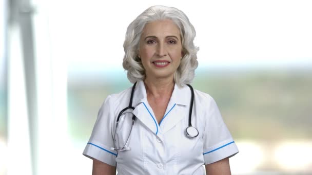 Portrait of happy female doctor. - Πλάνα, βίντεο