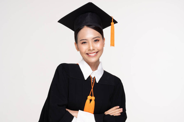 Beautiful Attractive Asian woman graduated in cap and gown smile so proud and happiness,Isolated on white background,Education Success Concept - Foto, Imagem