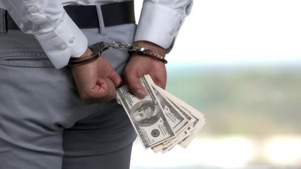 Man in handcuffs holding money. - Footage, Video