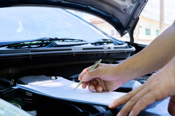 Professional auto mechanic working in repairing service, close-up. Car diagnostics concept - Φωτογραφία, εικόνα