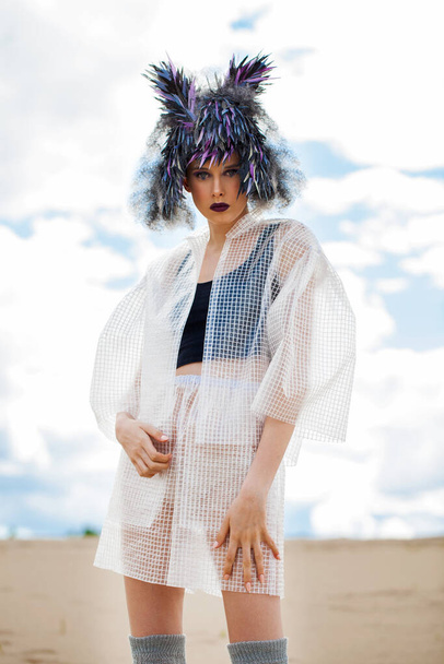 portrait of fashion model in designer clothes with a bird feather wig - Φωτογραφία, εικόνα