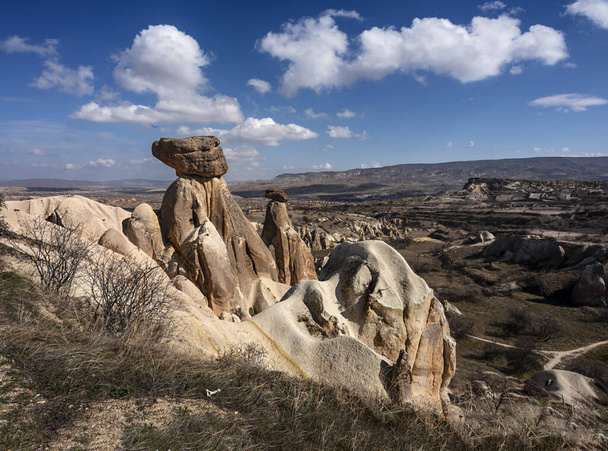 Cappadocia is an interesting place for both local and foreign tourists with its extraordinary beauty. Fairy chimneys, even in the list of places that must be visited in Turkey prepared by the foreign takes first place in most lists. - Zdjęcie, obraz