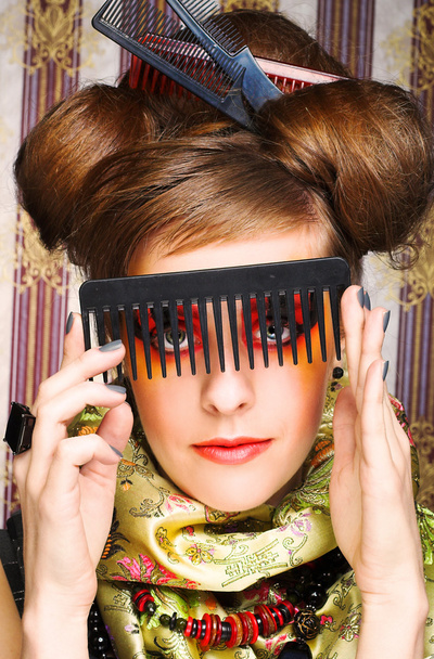 Woman with combs. - 写真・画像