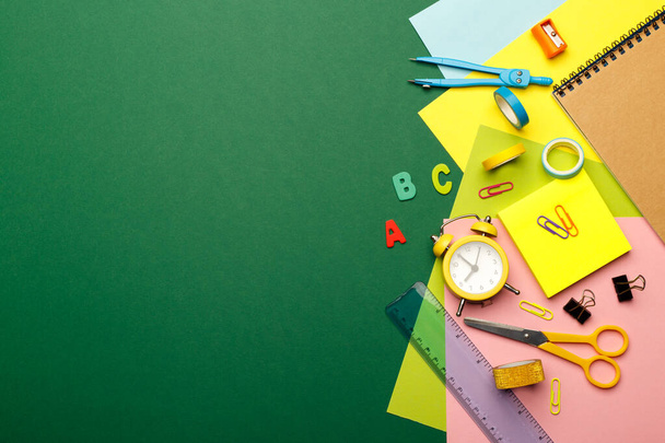 Back to school concept. Colorful stationary school supplies on green background, space or text flat lay - Foto, Imagem