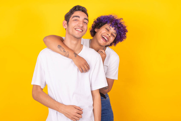 happy young couple isolated on color background - Photo, Image