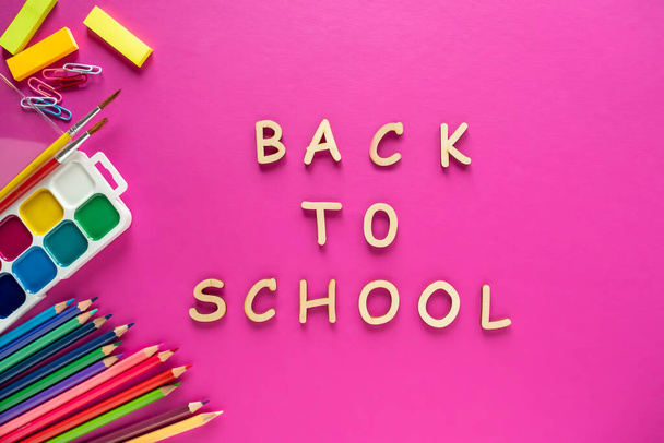 School supplies on pink background. Back to school. Top view - Фото, зображення