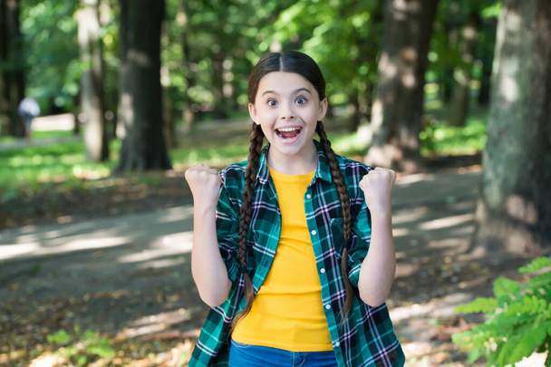 Girl scout cute braids wear checkered clothes nature background, childhood happiness concept - Fotó, kép