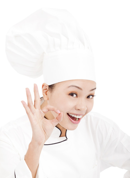 Mujer bonita cocinero panadero o cocinero mostrando ok signo de mano
 - Foto, Imagen
