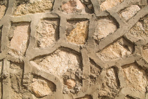 muro de piedra primer plano, textura, foto en colores cálidos - Foto, imagen