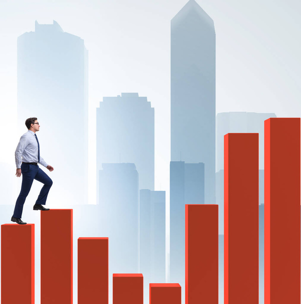 Businessman going up the bar chart in growth concept - Photo, Image