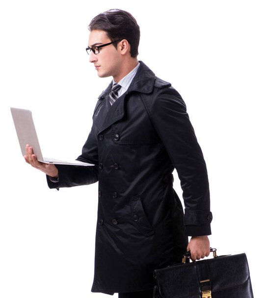 молодой бизнесмен с ноутбуком изолированы на белом фоне - Фото, изображение