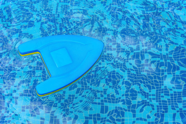 blue floating pad on a swimming pool - Photo, Image