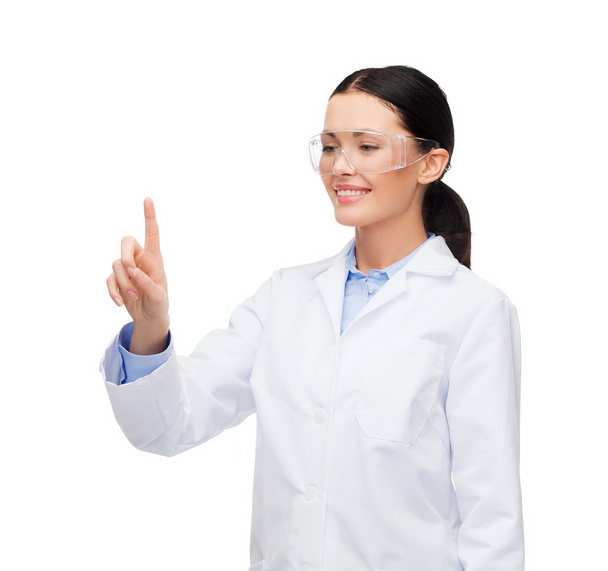 Smiling female doctor pointing to something - 写真・画像