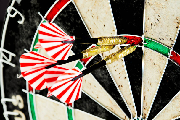 Three darts hit exactly the three-point target area. Business center goal concept. - Photo, Image
