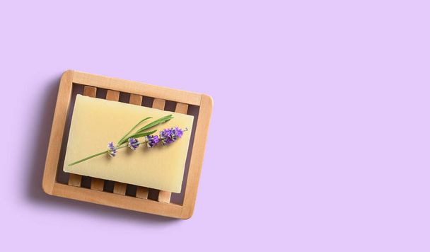 Homemade lavender soap on wooden dish. Copy space - Фото, зображення