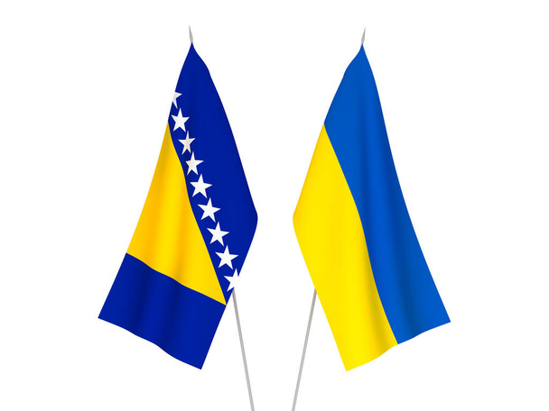 Nationalflaggen der Ukraine und Bosnien und Herzegowinas isoliert auf weißem Hintergrund. 3D-Darstellung. - Foto, Bild