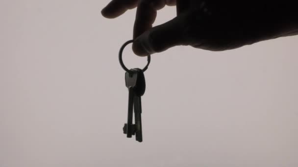 bunch of home keys sway in hand. backlight - Footage, Video
