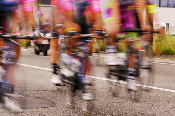 Group of Cyclists  during  a rage. blurred photo - Photo, Image