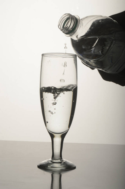 Pouring water in glass, Glassware, Dropping, Wine - Φωτογραφία, εικόνα