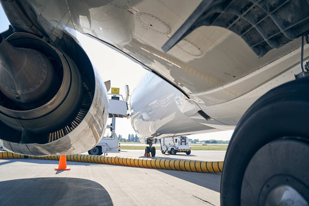 Airplane serviced during the refueling process at the airdrome - Photo, Image