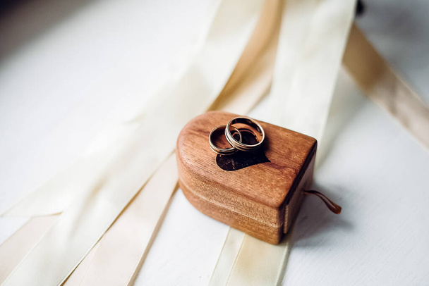 wedding rings, wedding rings and bouquet in one composition, ring box, wedding day, close-up - Photo, image