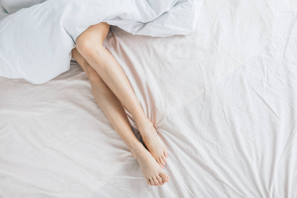 sexy legs in the bed . - Φωτογραφία, εικόνα