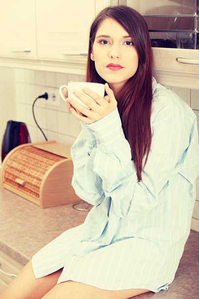 A young woman having morning coffee - Foto, Bild