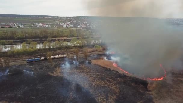 Aerial view of wildfire, spreading flames of forest fire. Natural disaster due to extreme heat and climate change - Záběry, video
