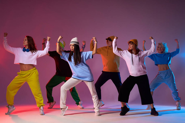 Group of energetic dancers on stage - Фото, изображение