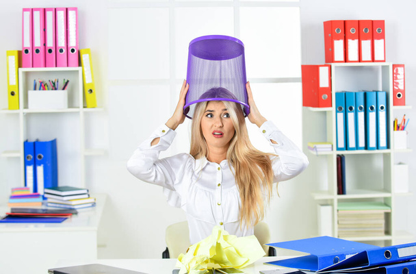 Girl looking for lost document. Crazy office worker having fun. Office garbage concept. Woman hold garbage bin. Search among garbage. Cancel file deletion. Dispose waste paper. Manager and trash can - Фото, зображення