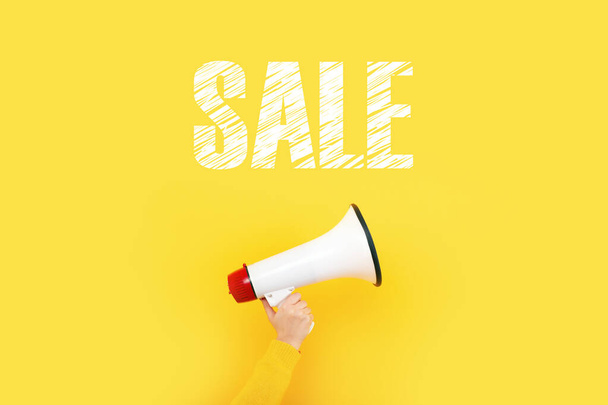 megaphone and inscription sale on a yellow background - Photo, Image