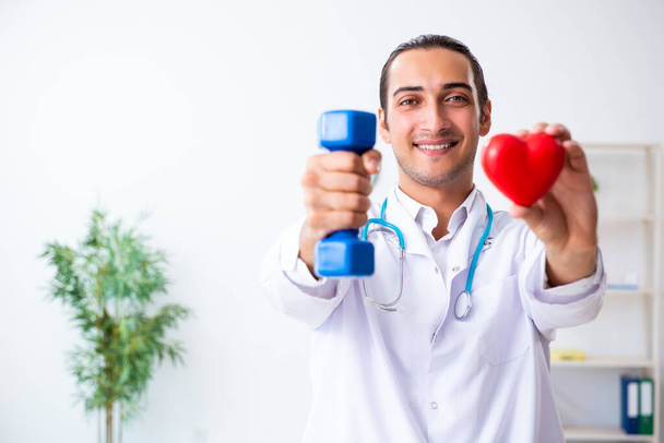 Young male doctor in sport and dieting concept - Photo, Image