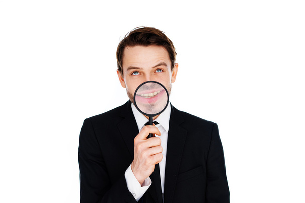 Businessman with a magnified smile - Photo, Image