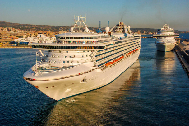Civitavecchia, Italy - September 2011: Cruise liner Grand Princess leaving the dockside at sunset. - Photo, Image