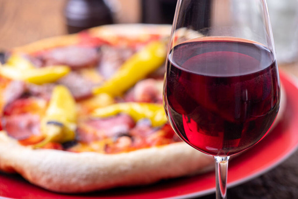 red wine and a fresh pizza - Photo, image