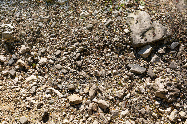 Структура кам'яного ґрунту. Фон зображення кам'яної крихти з дрібними і великими каменями. крупним планом
 - Фото, зображення
