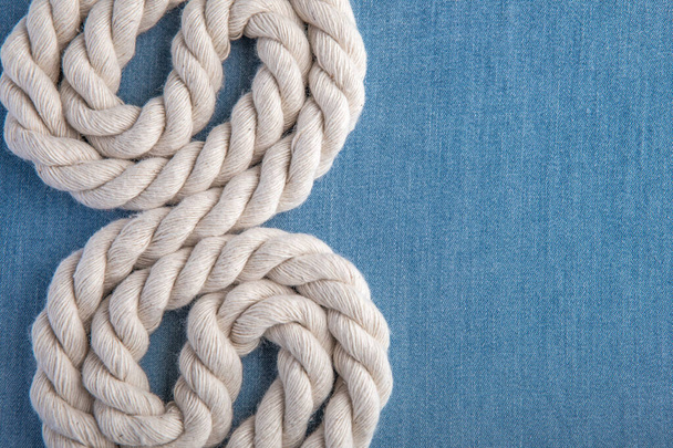 white rope on blue jeans - Fotoğraf, Görsel