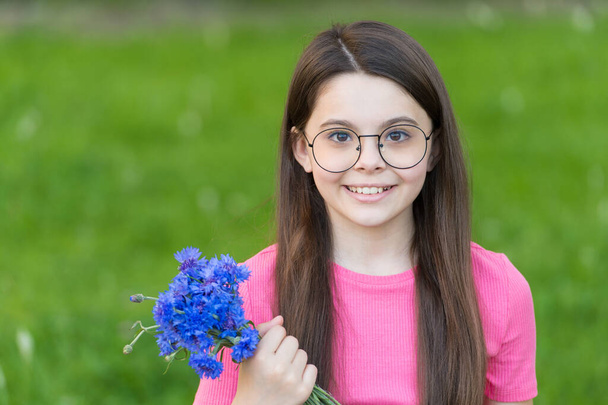 Little girl wear vintage rim eyeglasses green lawn background, beautiful child concept - Foto, imagen