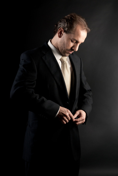 ビジネスマン ボタン ジャケット、暗い背景に服を着る - 写真・画像