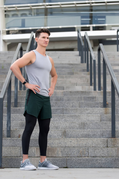 guy wearing sportswear. Muscular young fitness sports man athlete in compression garment. Staying fit and healthy. ready for stretching exercises. Balancing his mind and body - Foto, Imagem