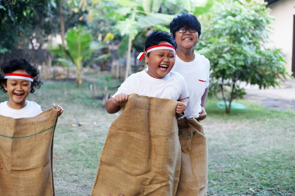 The excitement of the sack race ahead of Indonesia's Independence Day - Photo, Image