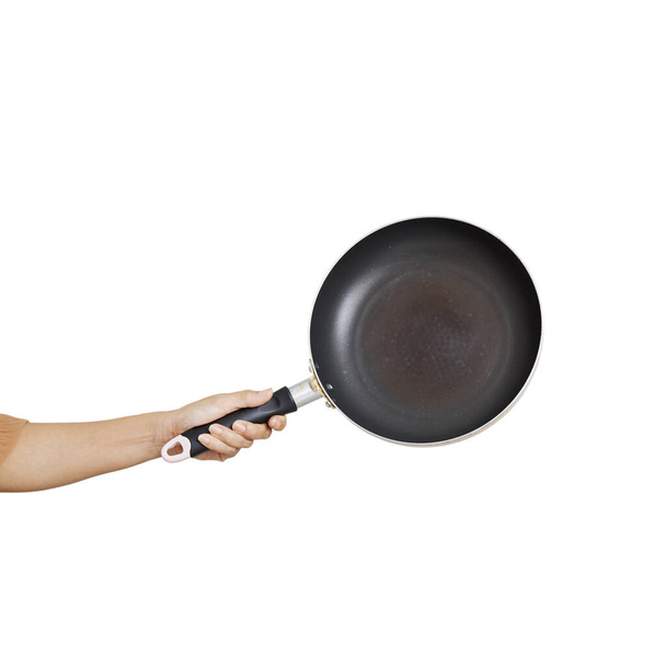 Pan bakken met de hand op witte achtergrond keukengerei voor het koken - Foto, afbeelding
