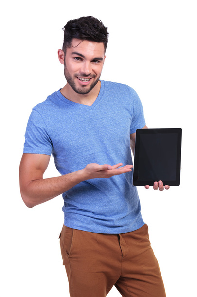 casual man presenting a talbet pad screen - Photo, image