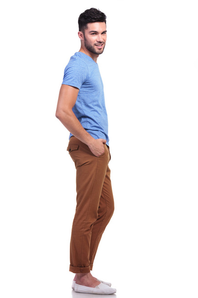 young casual man with hands in his pockets - Foto, afbeelding