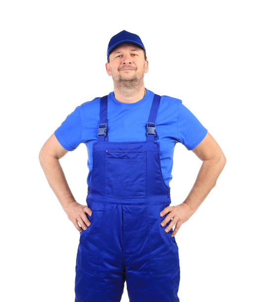 Worker in blue overalls. - 写真・画像