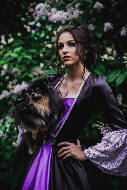 Lady in black and purple baroque dress - Фото, изображение