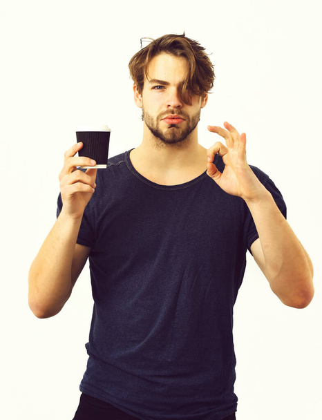 Caucasian sexy young macho holding coffee cup - Fotografie, Obrázek
